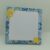 Gros plan sur un bloc-notes à carreaux A6 de 60 pages pour liste de tâches, bordure décorative style Azulejos et citrons.